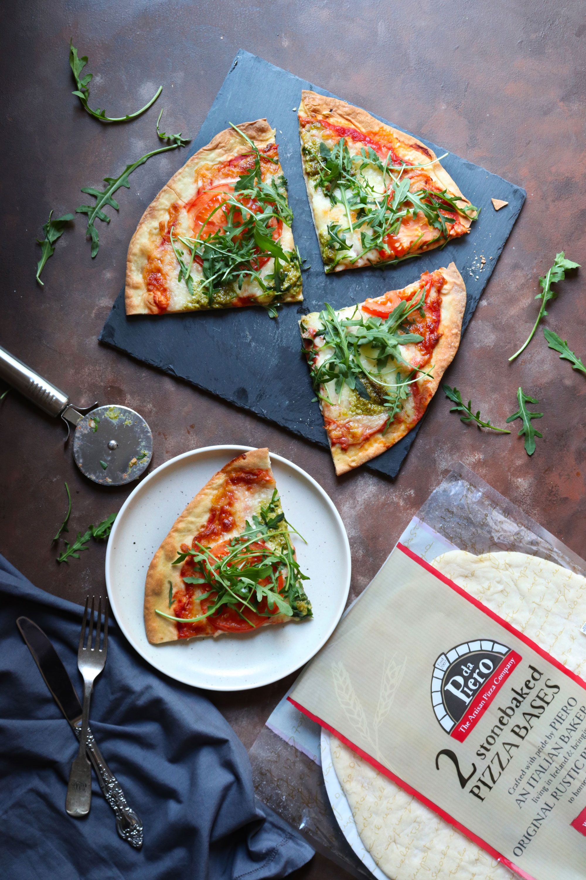 tomato mozzarella and basil pesto pizza