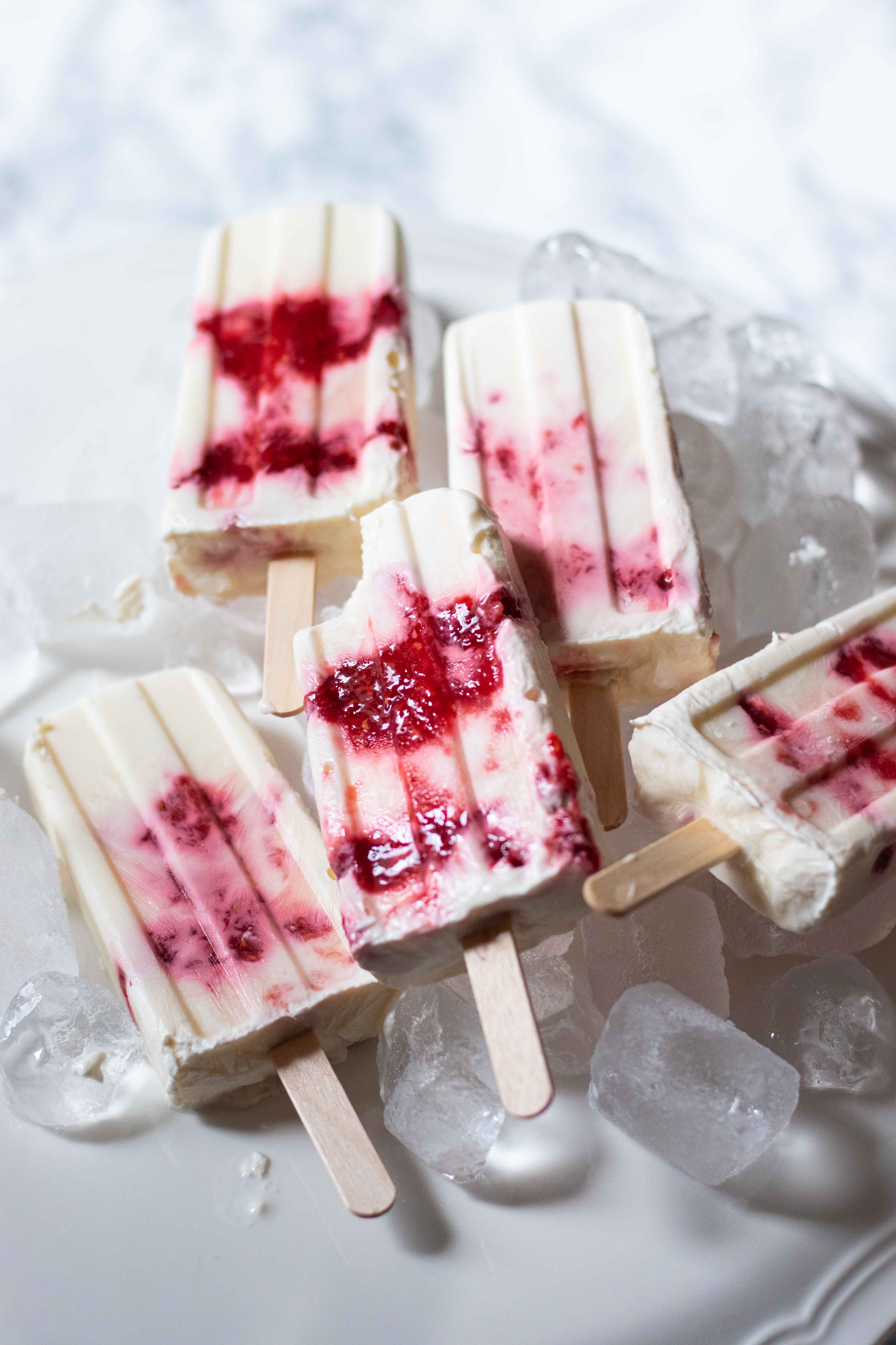 greek yogurt and berry jam popsicles