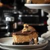 Baked coffee cheesecake with dark chocolate ganache and mocha cream frosting